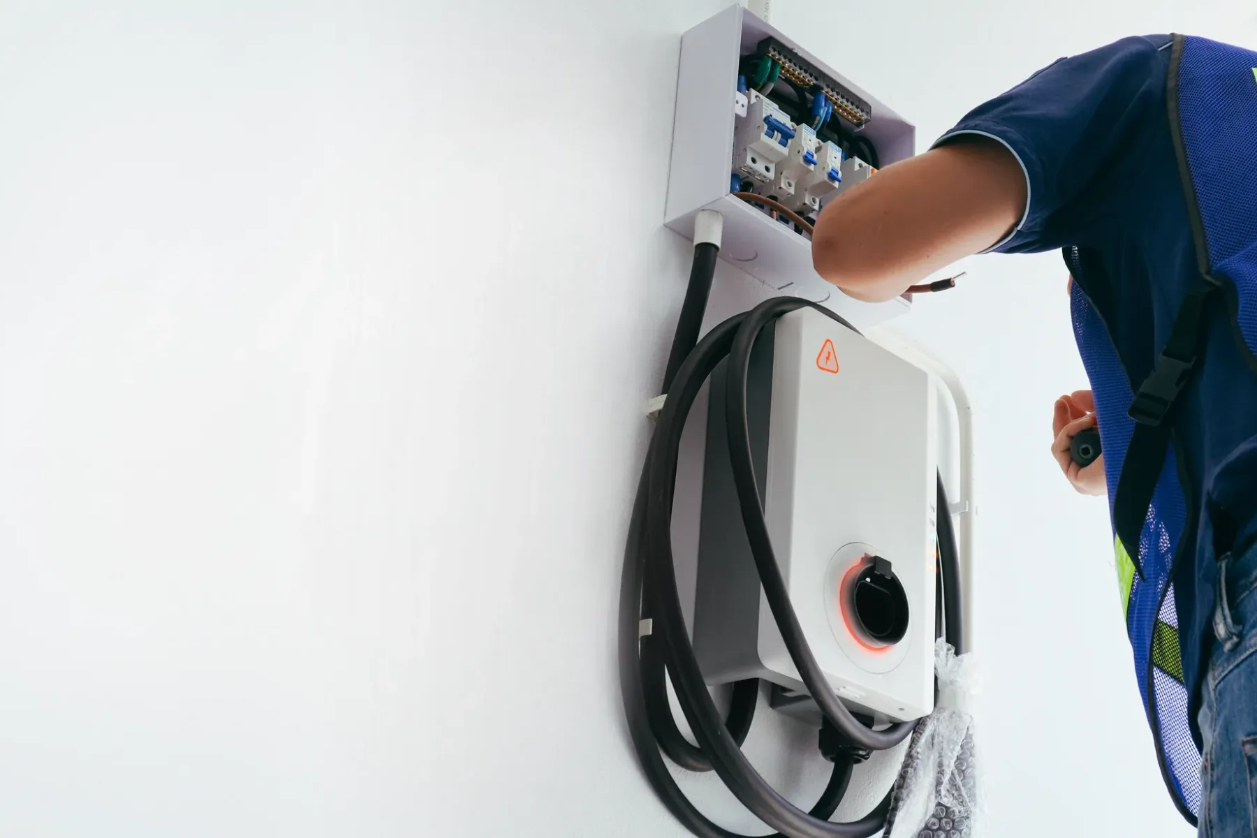 Technician working on electric charging equipment.